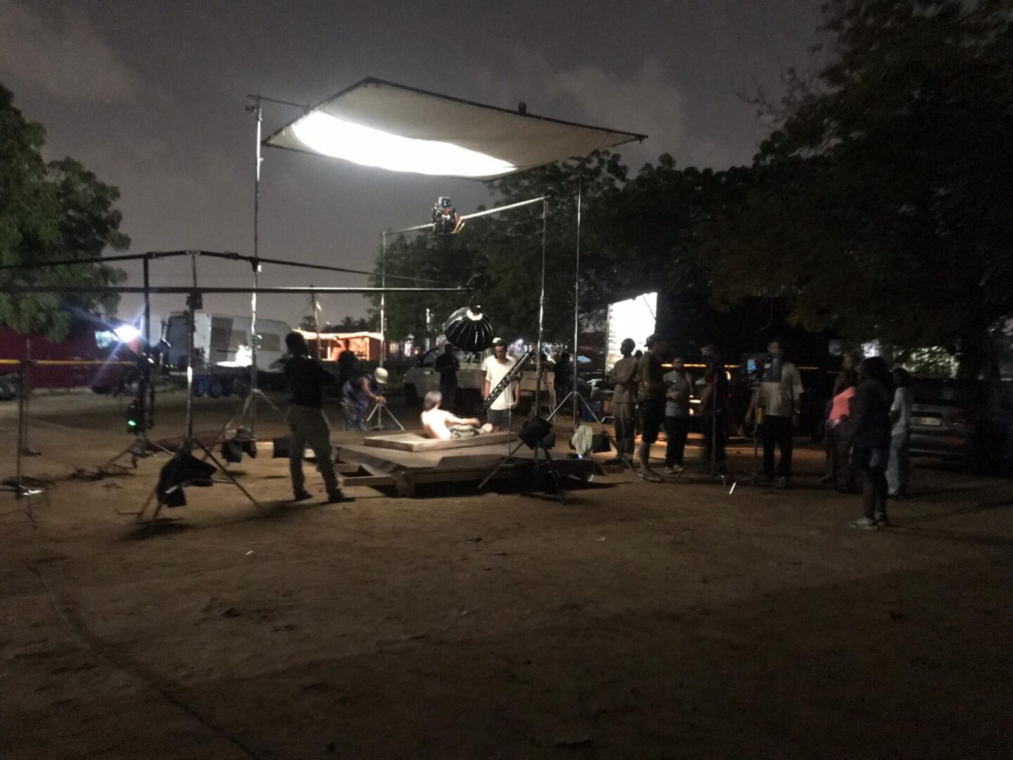 Nighttime film set with crew