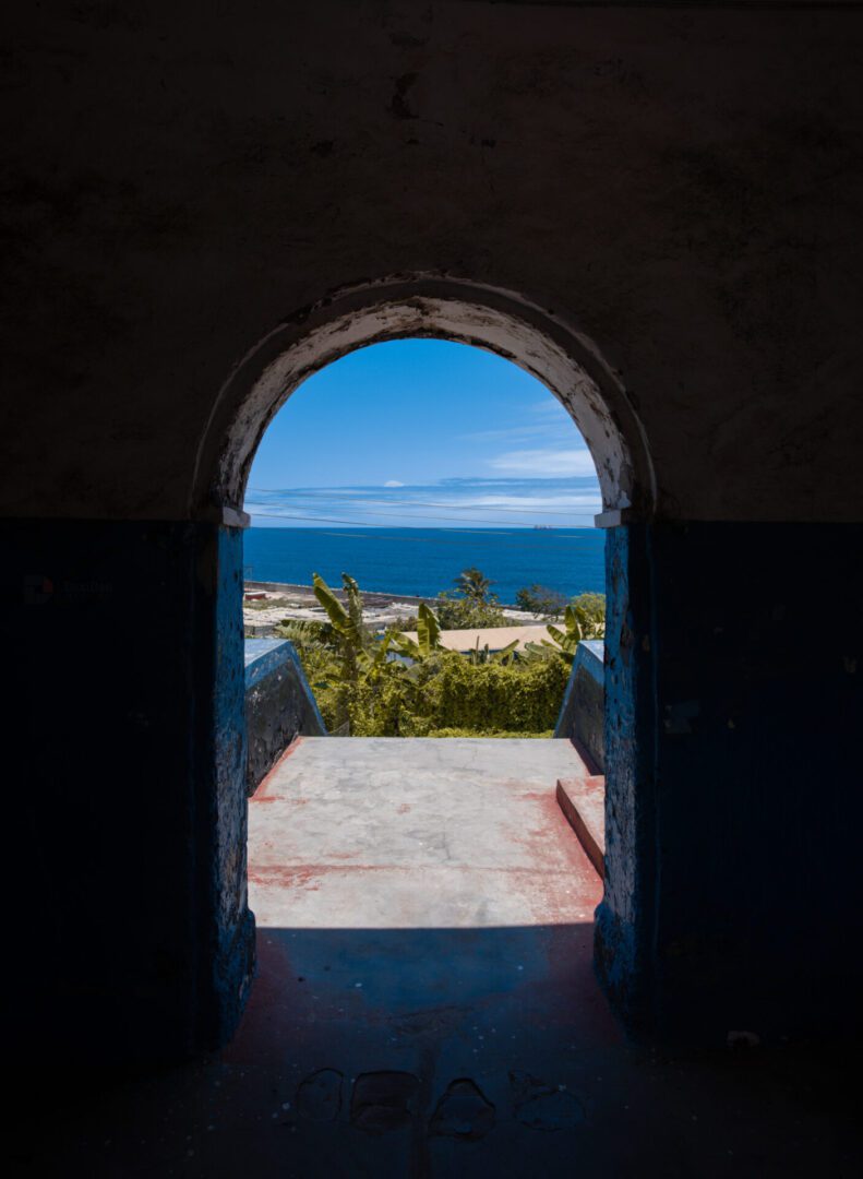 Blue sea framed by archway