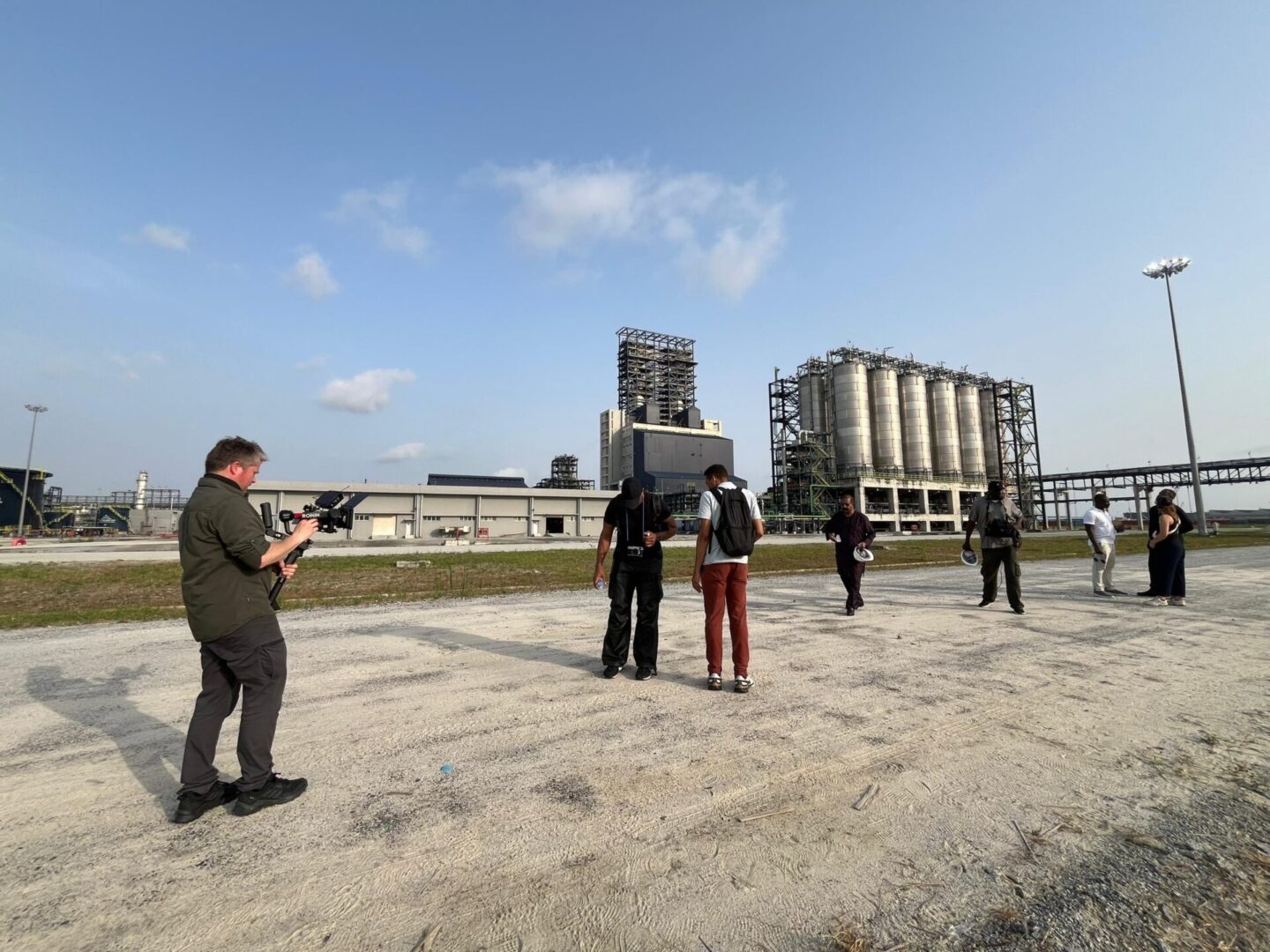 Photographer capturing industrial facility tour