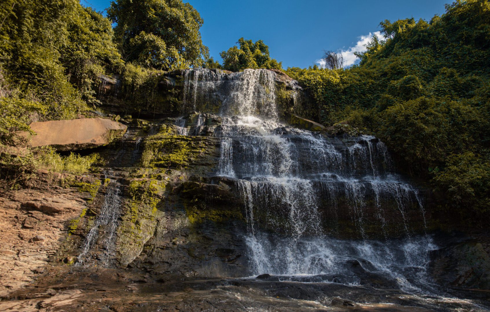 Scenic waterfall under blue sky