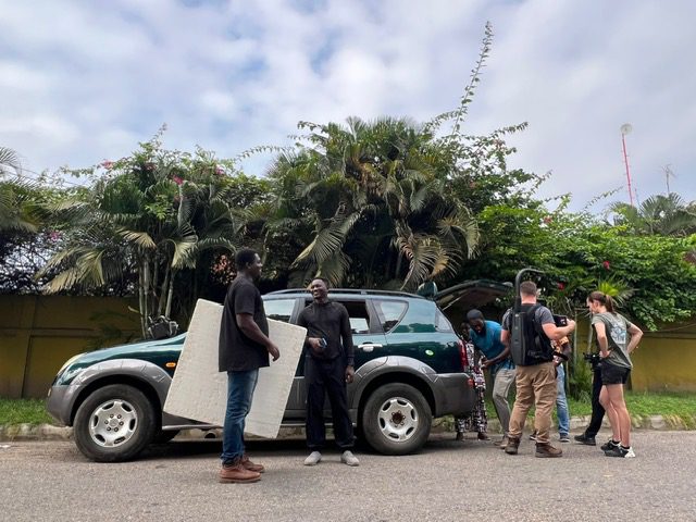 Outdoor meeting near a vehicle