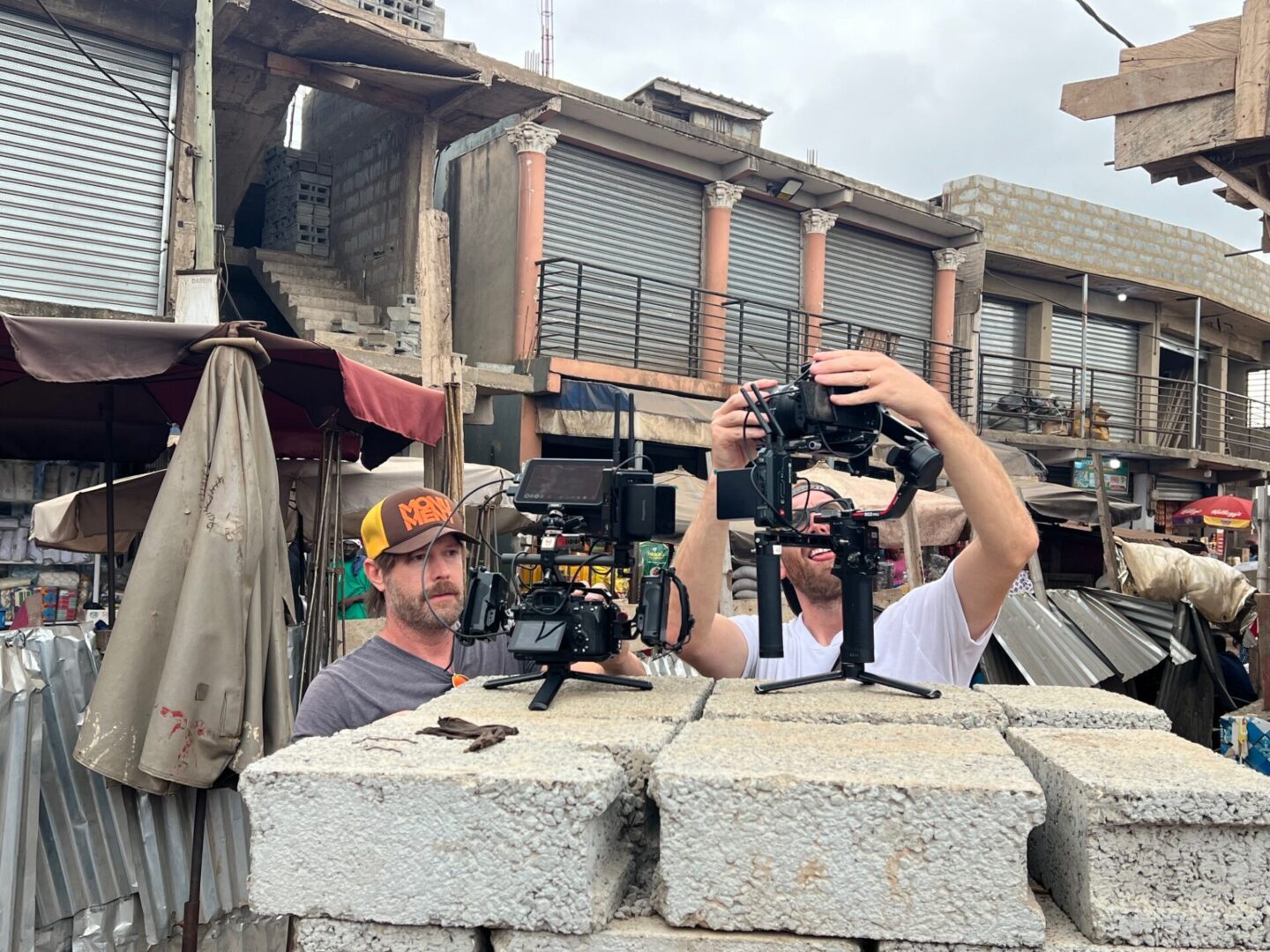 Film crew setting up cameras outdoors
