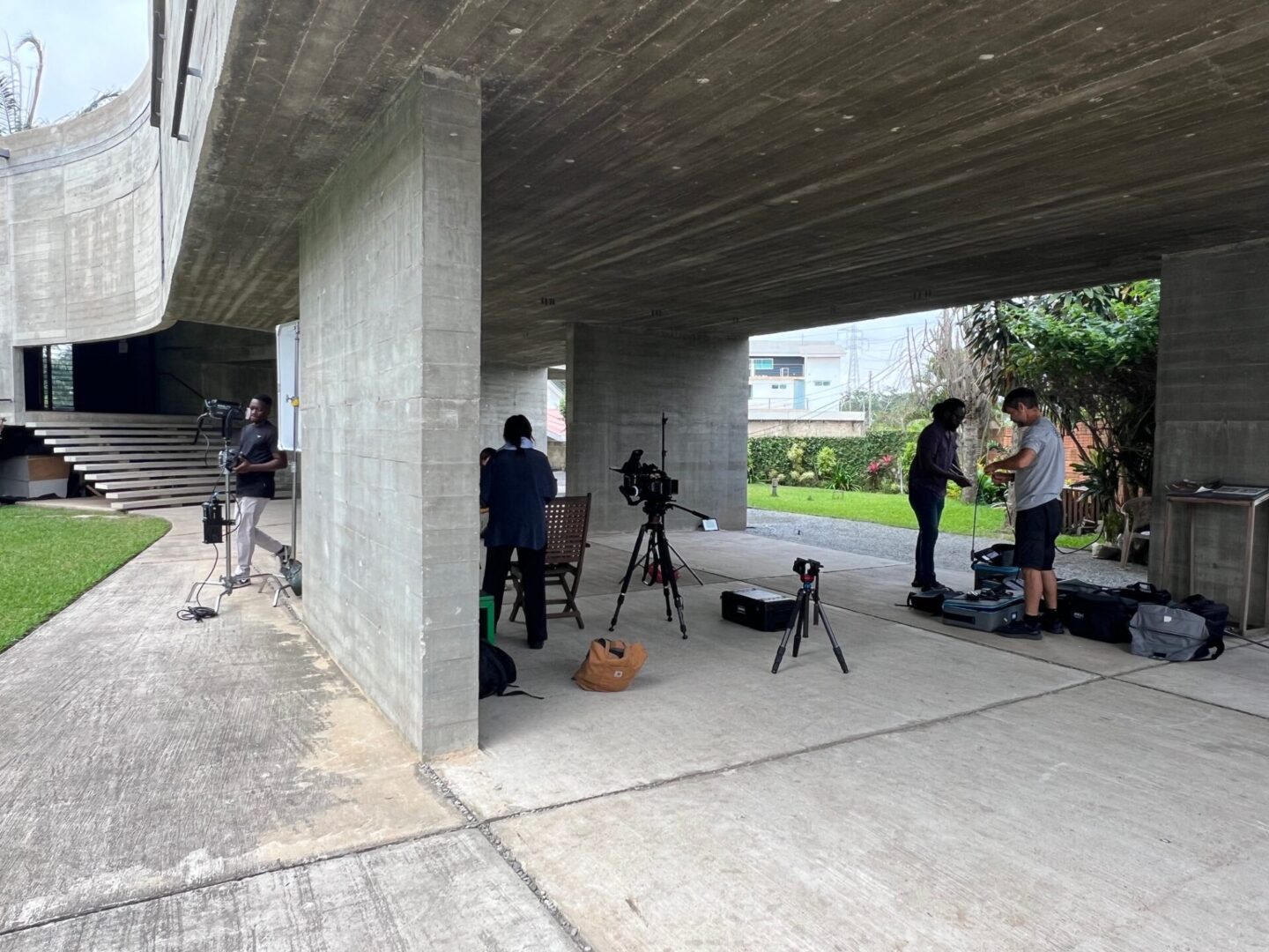 Outdoor filming scene under concrete structure