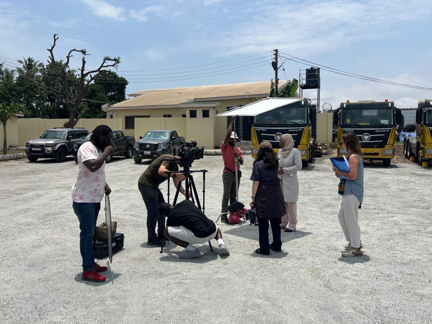 People filming in a parking lot