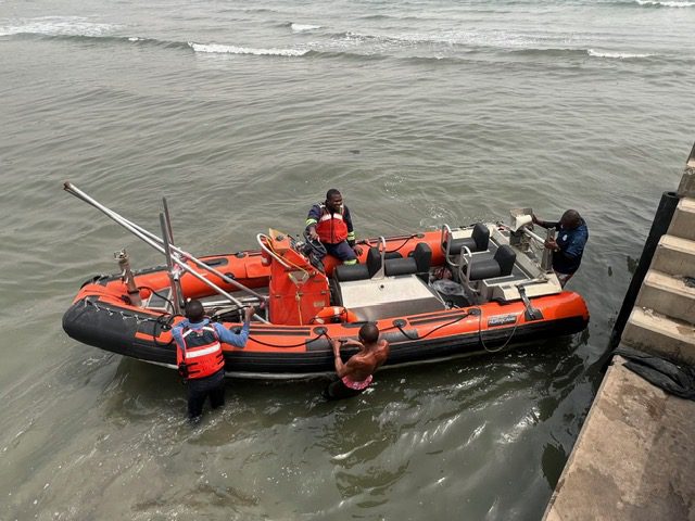 People on orange rescue boat