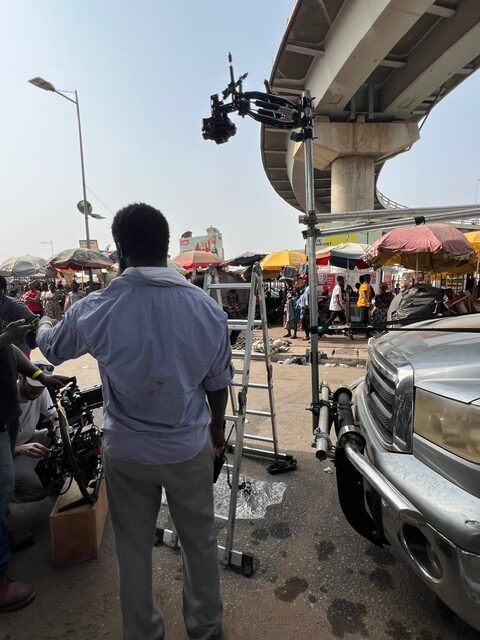 Man directing street film scene