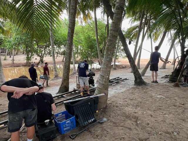 Movie production near a tropical beach