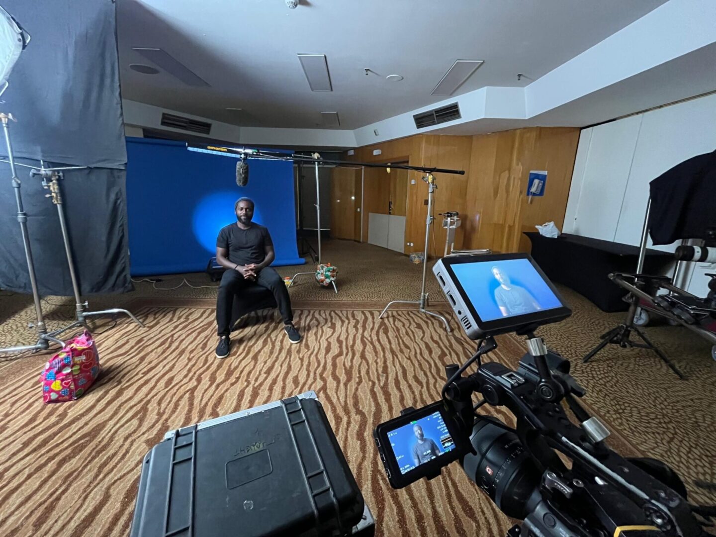Indoor film production scene with lights